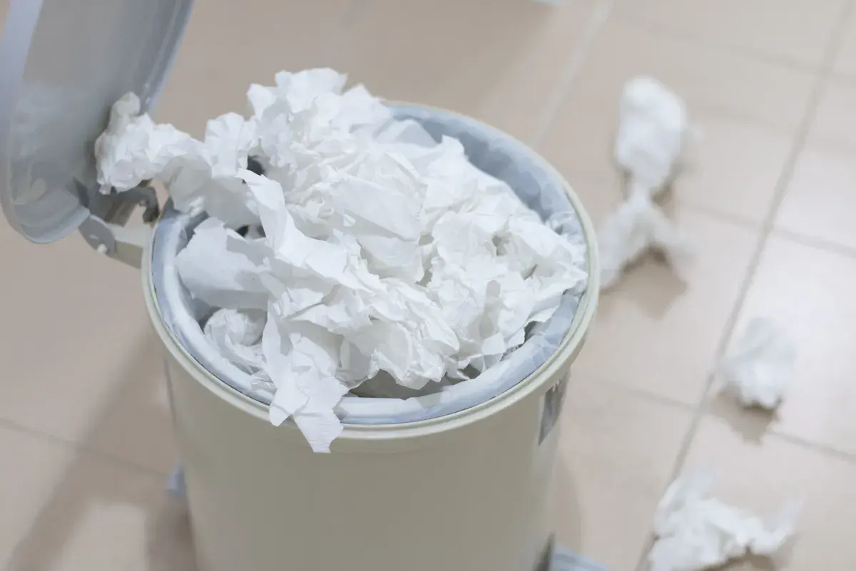 An overflowing wastebin