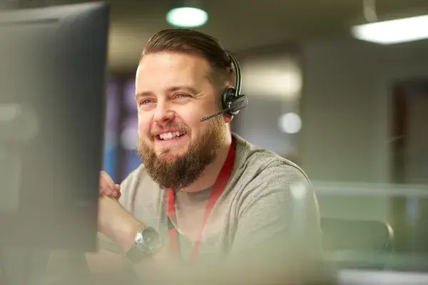A close up picture of the customer care worker on a call